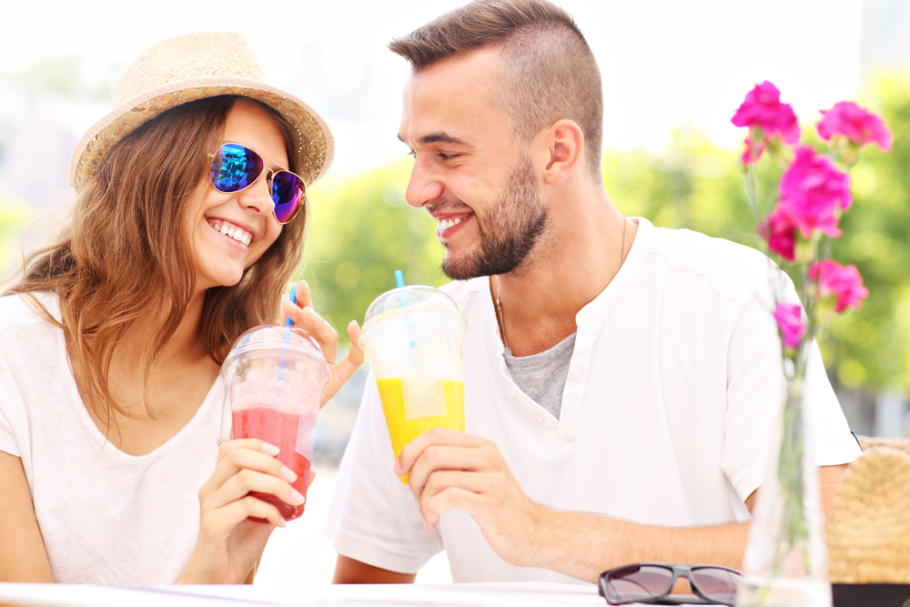 couple enjoying cocktails at a hotel