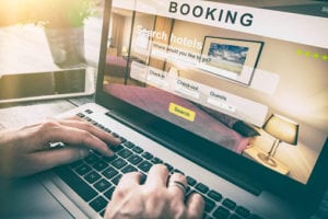 Man using hotel booking engine software
