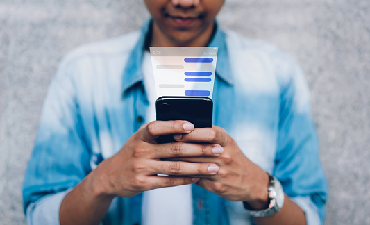 Man using chat message app on smartphone